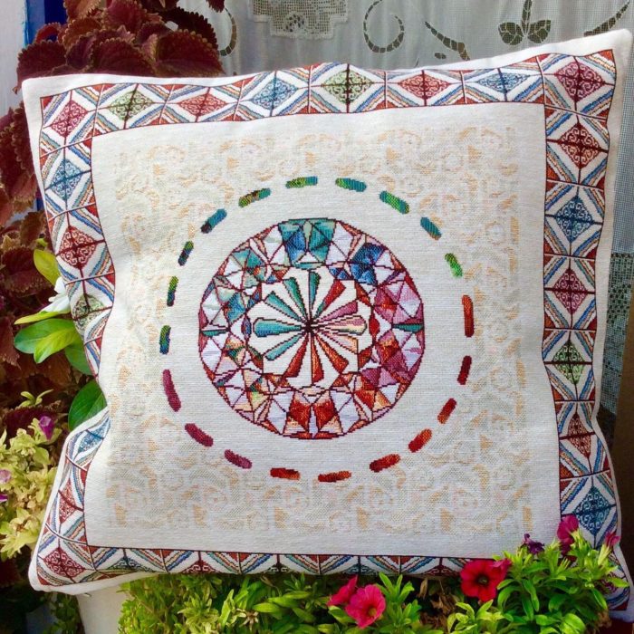 Decorative cushion with a traditional greek geometric pattern